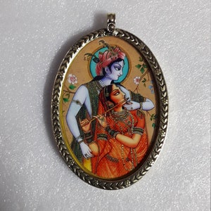 Handmade Glass Framed Hindu Deity Love Couple Radha Krishna Yellow Brass Oval Shap Photo Pendant With Brass Chain And Colour String