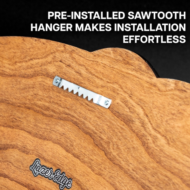 a wooden surface with a metal bracket attached to it, indicating that a pre-installed sawtooth-style hanger is being used for installation.