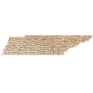 May include: A map of Tennessee showing the state's 95 counties. The map is made of wood and has a light brown color. Each county is outlined in black and labeled with its name.
