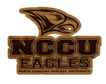 May include: A brown wooden sticker with a brown eagle head and the text "NCCU EAGLES" in black letters. Below the text is "NORTH CAROLINA CENTRAL UNIVERSITY" in smaller black letters.