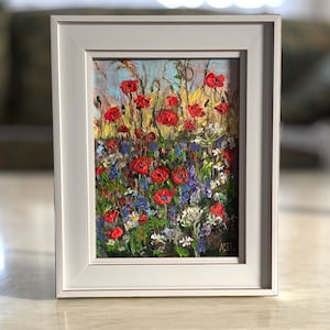 Cuadro floral enmarcado con flores coloridas, decoración rústica para el hogar.