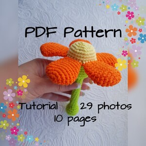 以下が含まれることがあります： 29枚の写真と10ページのクロシェフラワーパターン。花はオレンジとイエローで、茎はグリーンです。パターンはPDFダウンロードで入手できます。