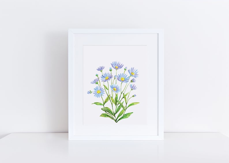May include: A framed watercolor painting of a bouquet of light blue flowers with yellow centers and green stems. The flowers are arranged in a cluster and are set against a white background.
