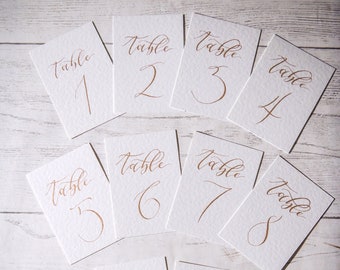 Hand lettered calligraphy table names/numbers - CLEAN range - on white hammered card