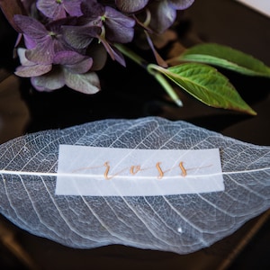Place cards - ivory leaf skeletons with gold hand calligraphy on vellum
