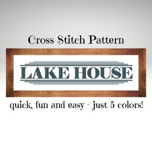 May include: Cross stitch pattern for a sign that says "LAKE HOUSE" in a dark blue color with a wood frame. The text below the sign says "quick, fun and easy - just 5 colors!"