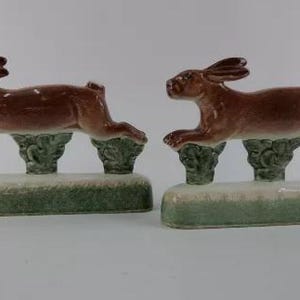 A rare pair of handpainted Rye Pottery, England figures in the form of running hares or maybe rabbits and perfect for ornamental bookends.