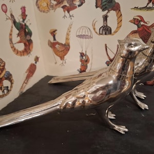 A late 20th century chrome plated salt and pepper / condiment set in the form of pheasants. Functional and decorative, fabulous table decor.