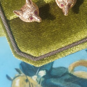 A vintage pair of fox mask earrings. 9ct gold fox head studs. Fully hallmarked with ruby faceted eyes. English foxhunting attire. Gold fox. image 2