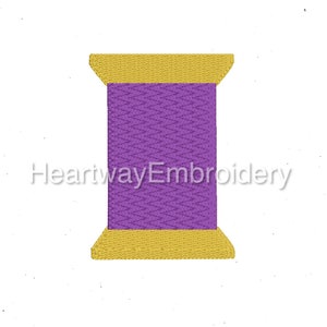 May include: A purple thread spool with a gold top and bottom. The spool is on a white background.