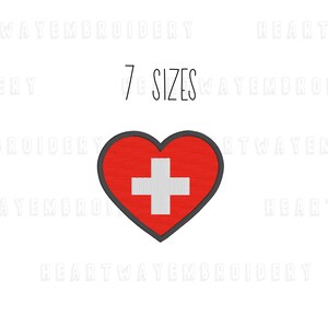 May include: A red heart-shaped patch featuring a white cross, edged in black. The text "7 SIZES" is above the heart. This design is suitable for embroidery or applique projects.