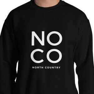 May include: Black sweatshirt with white text that reads "NO CO NORTH COUNTRY".