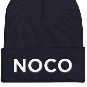 May include: A navy blue beanie with a white embroidered logo that says "NOCO".