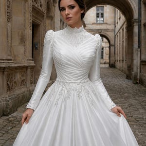 Modest wedding dress with high neck long sleeves, elegant satin styling and timeless bridal sophistication