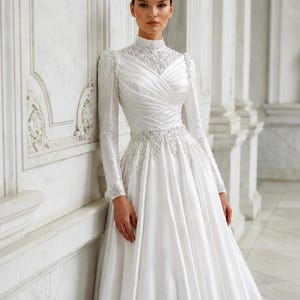 Structured bodice satin gown with elegant shaping and refined bridal craftsmanship