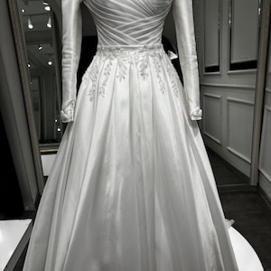 Edwardian bridal gown with refined structure, elegant coverage and timeless wedding day appeal