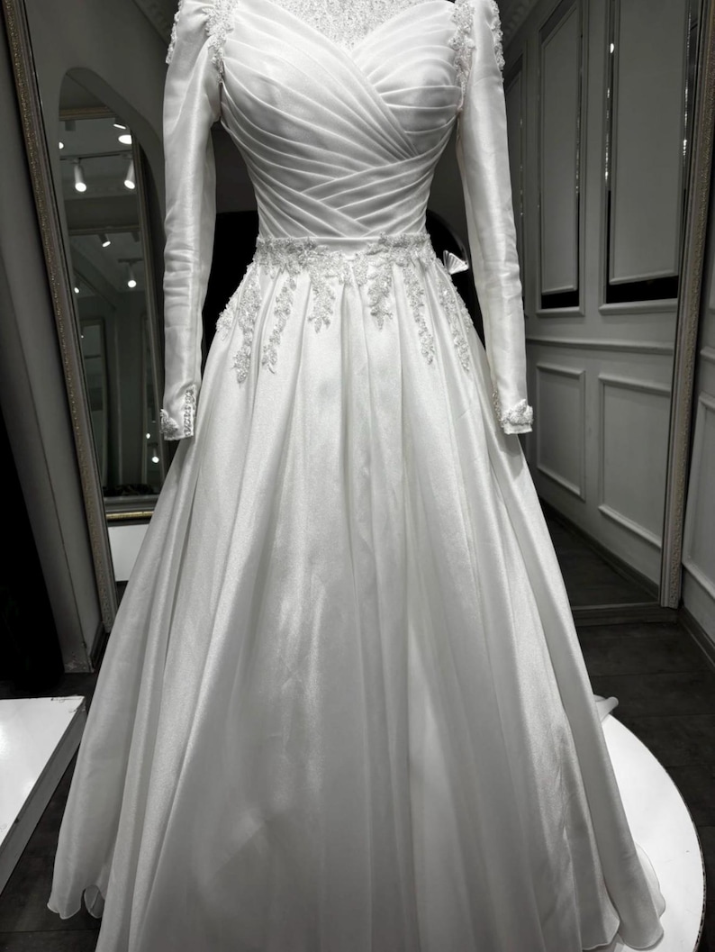 Edwardian bridal gown with refined structure, elegant coverage and timeless wedding day appeal