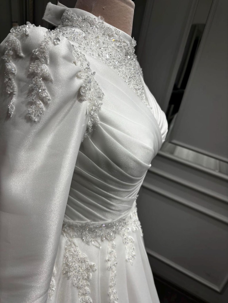 Simple wedding dress for an elegant bride with timeless satin styling and graceful bridal sophistication