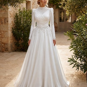 Church wedding gown for a modest bride with graceful coverage and traditional bridal elegance