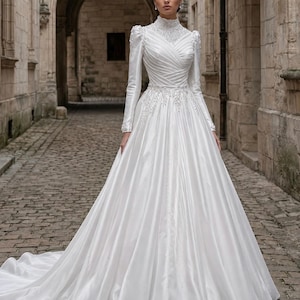 Satin ball gown with pearl beaded details, graceful volume and classic bridal elegance