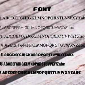 May include: Seven different font styles are displayed in black text on a woodgrain background. The text reads "FONT" at the top and then "#1 ABCDEFGHIGKLMNOPQRSTUVWXYZabc" through "#7 ABCDEFGHIGKLMNOPQRSTUVWXYZABC".