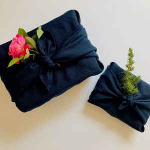 Dark blue furoshiki wrapping cloth. Blue linen furoshiki gift wrap. Sustainable furoshiki cloth. Eco-friendly fabric gift wrap ideas.