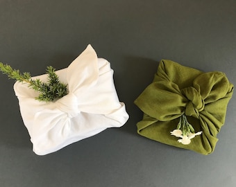 Reusable gift wrap with fabric. Furoshiki wrapping cloth. Linen furoshiki cloth. Eco-friendly gift wrapping alternatives. Zero waste gifts.