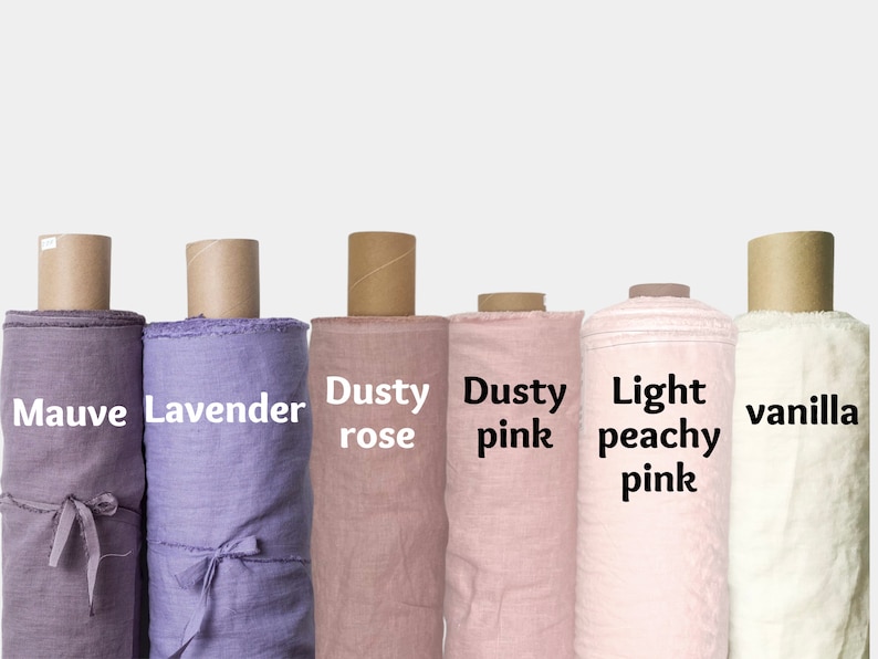 May include: Six rolls of fabric in various shades of pink, lavender, and white. The fabric rolls are labeled "Mauve", "Lavender", "Dusty rose", "Dusty pink", "Light peachy pink", and "vanilla".