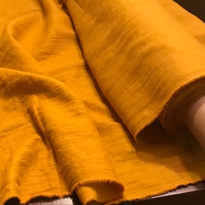 Mustard linen fabric by the yard. Yellow linen fabric by the metre. Brown shades. Soft, pre-shrunk, medium weight. Linen fabric for sewing.