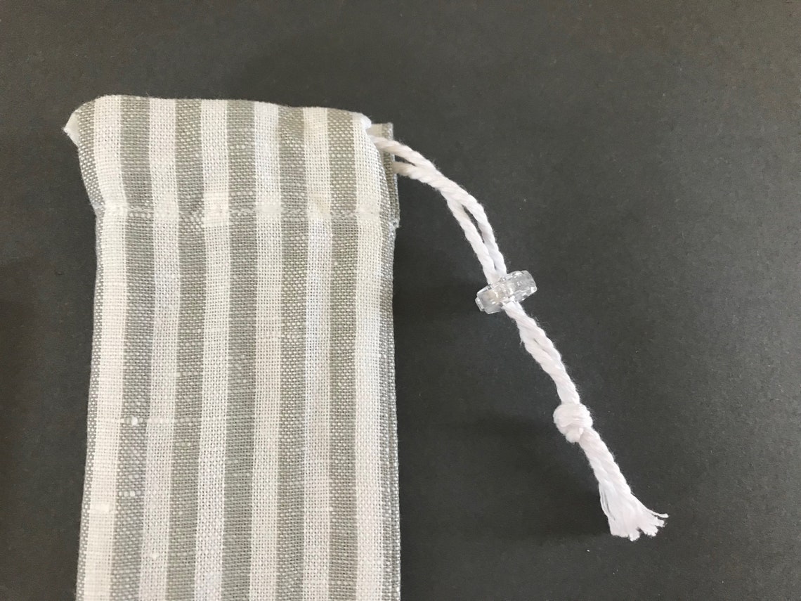 Striped linen drawstring straw pouch and reusable straws. Etsy