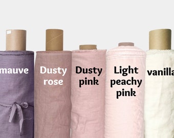 May include: Five rolls of fabric in different shades of pink and purple. The fabric rolls are labelled "mauve", "dusty rose", "dusty pink", "light peachy pink", and "vanilla".