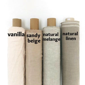 May include: Four rolls of fabric in different shades of beige and brown. The rolls are labeled "vanilla", "sandy beige", "natural melange", and "natural linen".