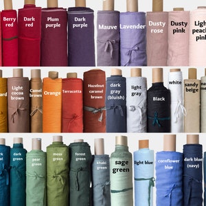 May include: A collection of fabric rolls in various colors, including raspberry pink, coral, berry red, dark red, plum purple, dark purple, mauve lavender, dusty rose, dusty pink, light peachy pink, vanilla, yellow, mustard, light cocoa brown, camel brown, orange, terracotta, hazelnut caramel brown, dark gray (bluish), light gray, black, white, sandy beige, natural melange, natural linen, mint green, dark teal, dark green, pear green, moss green, forest green, khaki green, sage green, light blue, cornflower blue, dark blue (navy), and steel blue.