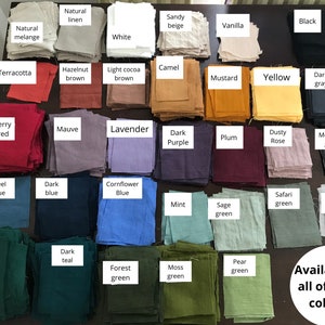 May include: A collection of fabric swatches in various colors, including natural linen, terracotta, berry red, mauve, lavender, dark purple, plum, dusty rose, medium gray, steel blue, dark blue, cornflower blue, mint, sage green, safari green, light gray, dark green, dark teal, forest green, moss green, and pear green. The text "Available in all of these colours" is written below the swatches.
