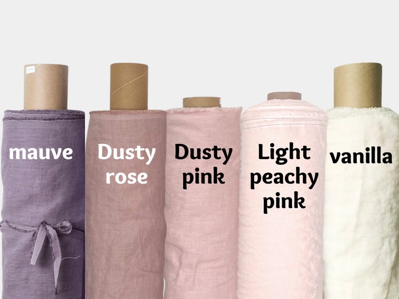 May include: Five rolls of fabric in different shades of pink and purple. The fabric rolls are labeled "mauve", "dusty rose", "dusty pink", "light peachy pink", and "vanilla".