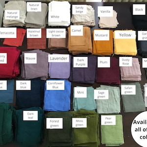 May include: A collection of fabric swatches in various colors, including natural linen, terracotta, berry red, mauve, lavender, dark purple, plum, dusty rose, medium gray, steel blue, dark blue, cornflower blue, mint, sage green, safari green, light gray, dark green, dark teal, forest green, moss green, and pear green. The text "Available in all of these colours" is written below the swatches.