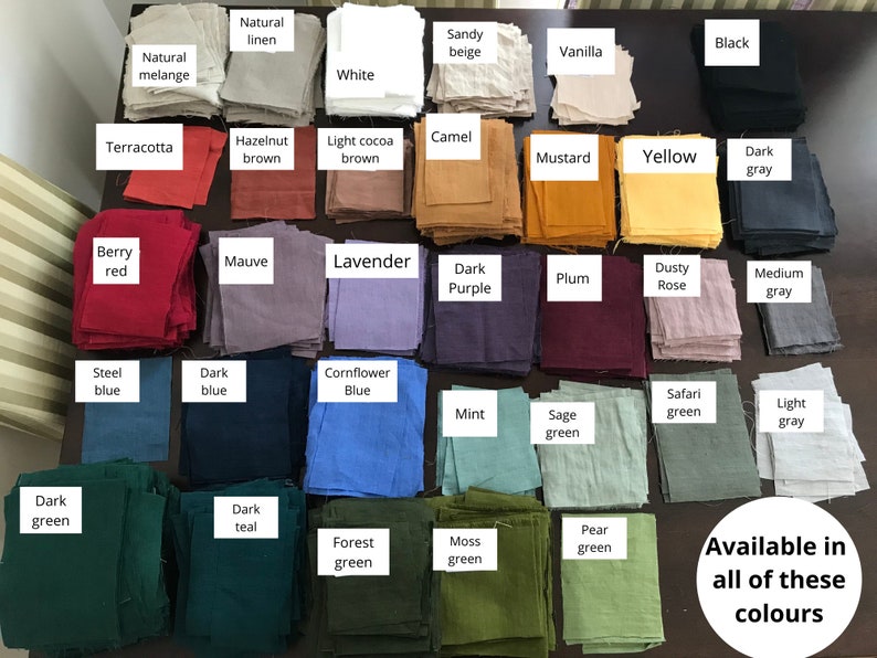 May include: A collection of fabric swatches in various colors, including natural linen, terracotta, berry red, mauve, lavender, dark purple, plum, dusty rose, medium gray, steel blue, dark blue, cornflower blue, mint, sage green, safari green, light gray, dark green, dark teal, forest green, moss green, and pear green. The text "Available in all of these colours" is written below the swatches.