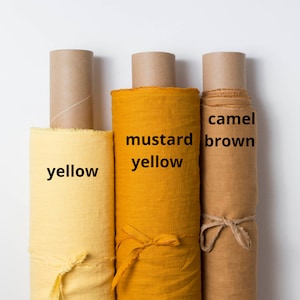 Mustard, yellow, camel linen fabric by the yard. Yellow linen fabric by the metre. Camel brown linen fabric. Washed, softened, pre-shrunk.