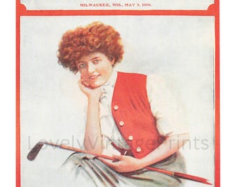 May include: A vintage magazine cover featuring a woman with red hair wearing a red vest and holding a golf club. The magazine is titled "Illustrated Sunday Magazine of the Sunday Sentinel" and the date is May 9, 1909.
