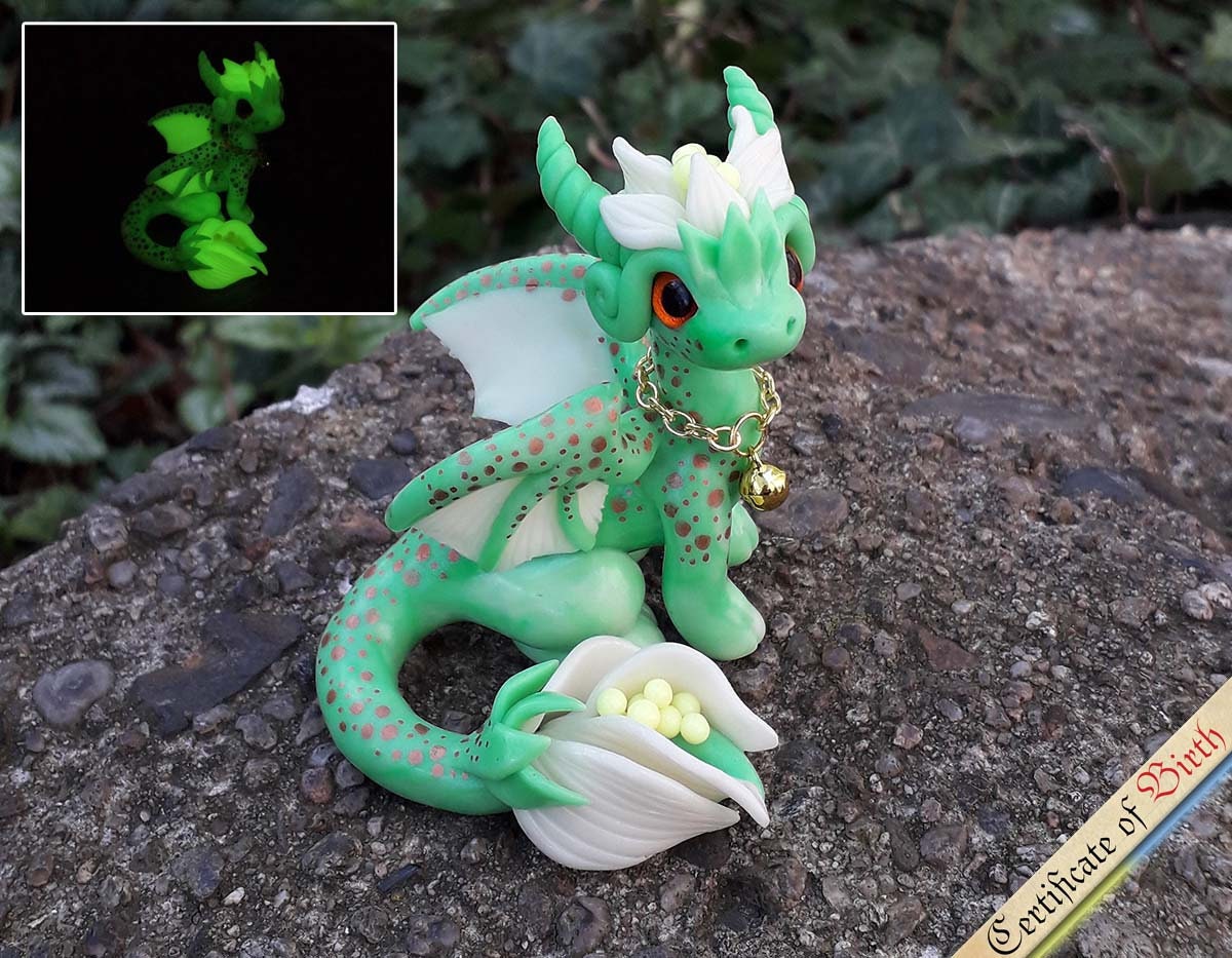 Polymer clay, glass dragon eye and raw crystal combined in…