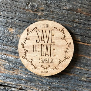 May include: A round wooden save the date card with a floral design and the text "7.7.20 Save the Date Sean & Lisa Pasadena, CA"