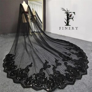 May include: A black tulle wedding veil with a scalloped edge and black sequins. The veil is long and flowing, and it would be a beautiful addition to any wedding.