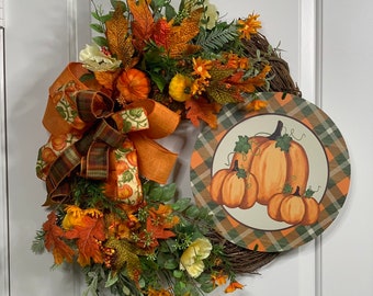 Seasonal pumpkins wreath, orange and green. Festive and vibrant, perfect for decoration!