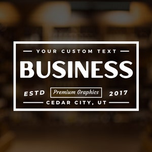 May include: White rectangular logo with a black background. The logo says "YOUR CUSTOM TEXT" at the top, "BUSINESS" in large letters in the middle, "ESTD" and "2017" on either side of "Premium Graphics" at the bottom, and "CEDAR CITY, UT" at the very bottom.