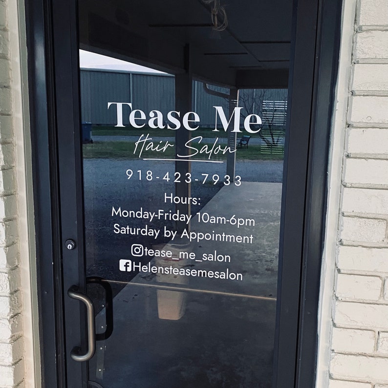 Vinyl decal applied to a business front door.