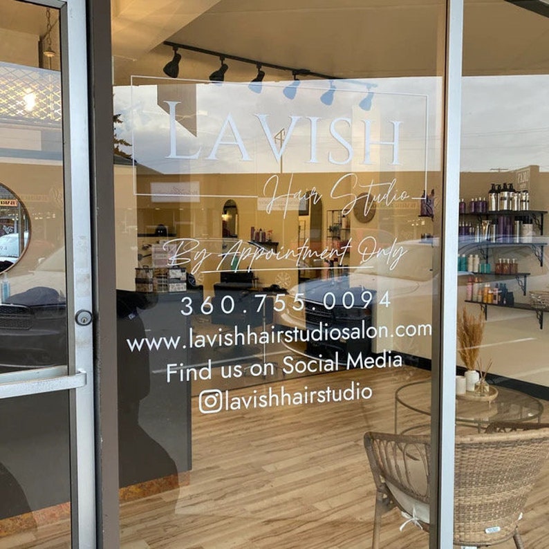Personalized vinyl decal installed on a glass business window.