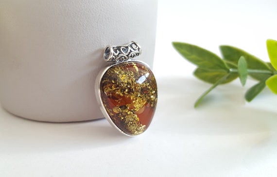 Green Amber Pendant Made of Baltic Amber.