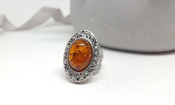Large Oval Amber Honey Ring in an Oxidized Sterling Silver Setting Large Oval Amber Honey Ring in an Oxidized Sterling Silver Setting