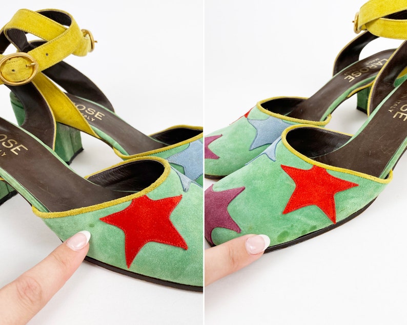 May include: A pair of green suede heeled shoes with a yellow ankle strap. The shoes have a star pattern with red, blue, and purple stars. The shoes are labeled "LAROSE ITALY".