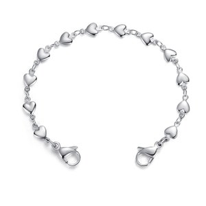 May include: A silver bracelet with a heart-shaped chain. The bracelet has a lobster clasp closure.